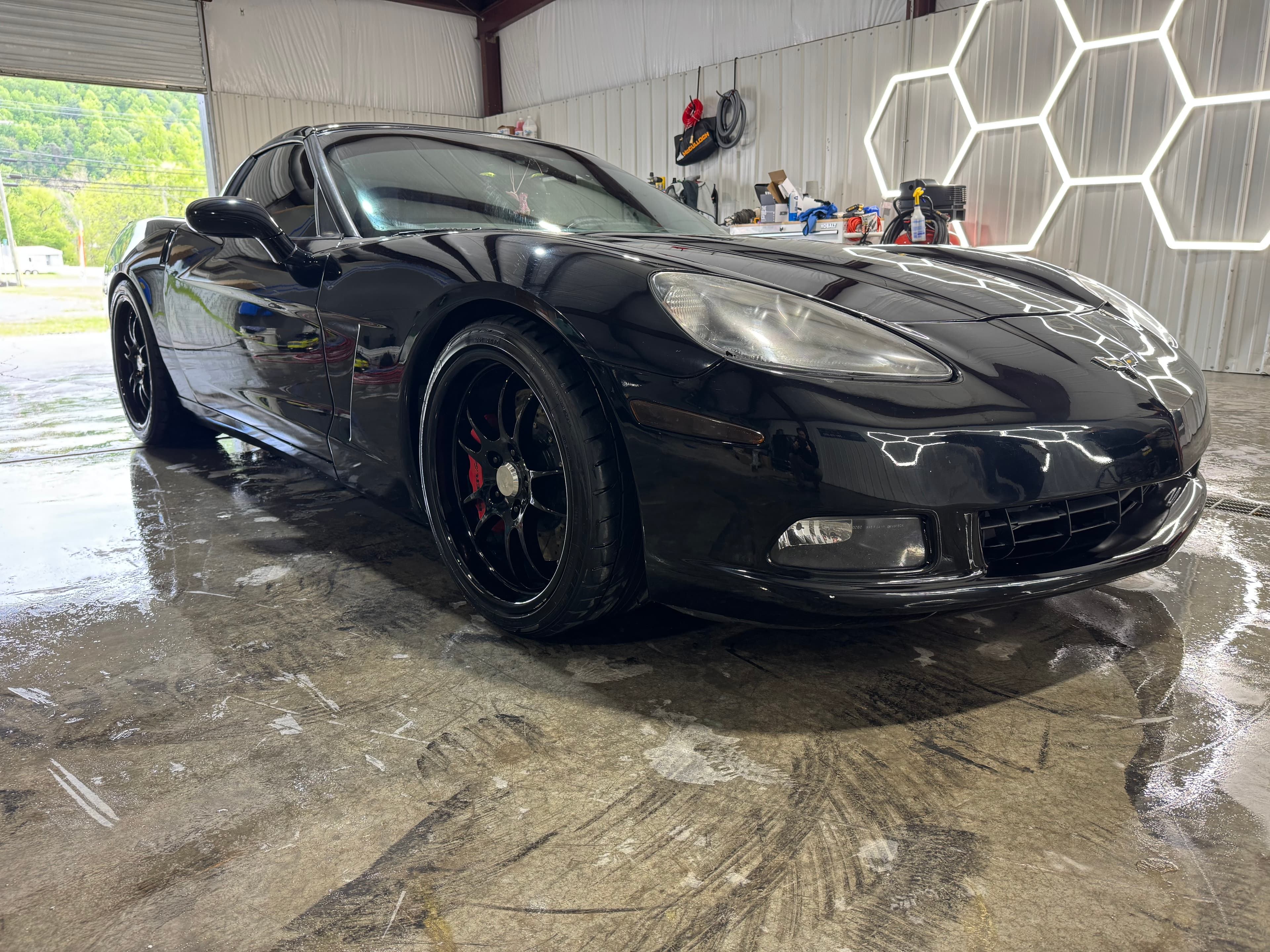 Black corvette with a fresh wash